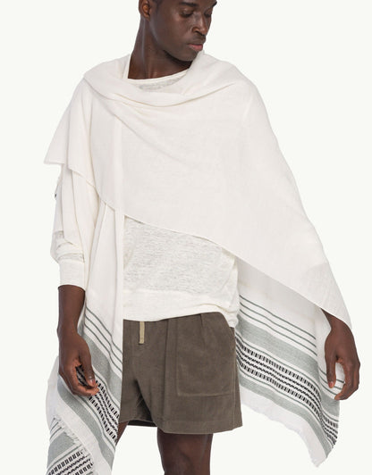 Explore our exclusive Ruanas, also known as capes or ponchos. Meticulously handcrafted by Peruvian Inca artisans over two days, each piece is a limited expression of ancient artistry adapted for the contemporary wardrobe. Made with superior Pima yarn, renowned for its exceptional quality and softness, our Ruanas offer a light embrace and sublime touch, seamlessly blending luxury with comfort.