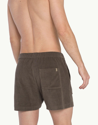 Versatile summer luxury shorts with a towel-like feel, ideal for beach getaways or nights out. Made from 100% certified organic cotton in grey.