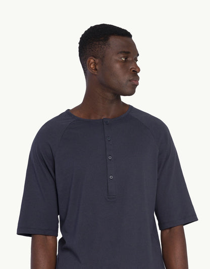 Discover sustainable fashion for men with our polo t-shirt Indigo T-shati color. Crafted for everyday luxury, our tees provide unmatched softness and all-day comfort. Stay cool in our breathable organic cotton tees for men, made from 100% organic cotton to champion sustainability and skin-friendly choices.
