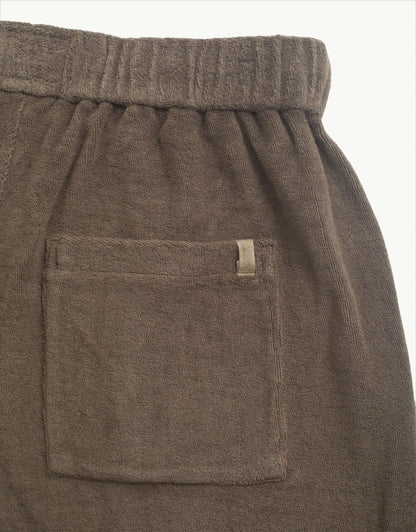 Versatile summer luxury shorts with a towel-like feel, ideal for beach getaways or nights out. Made from 100% certified organic cotton in grey.
