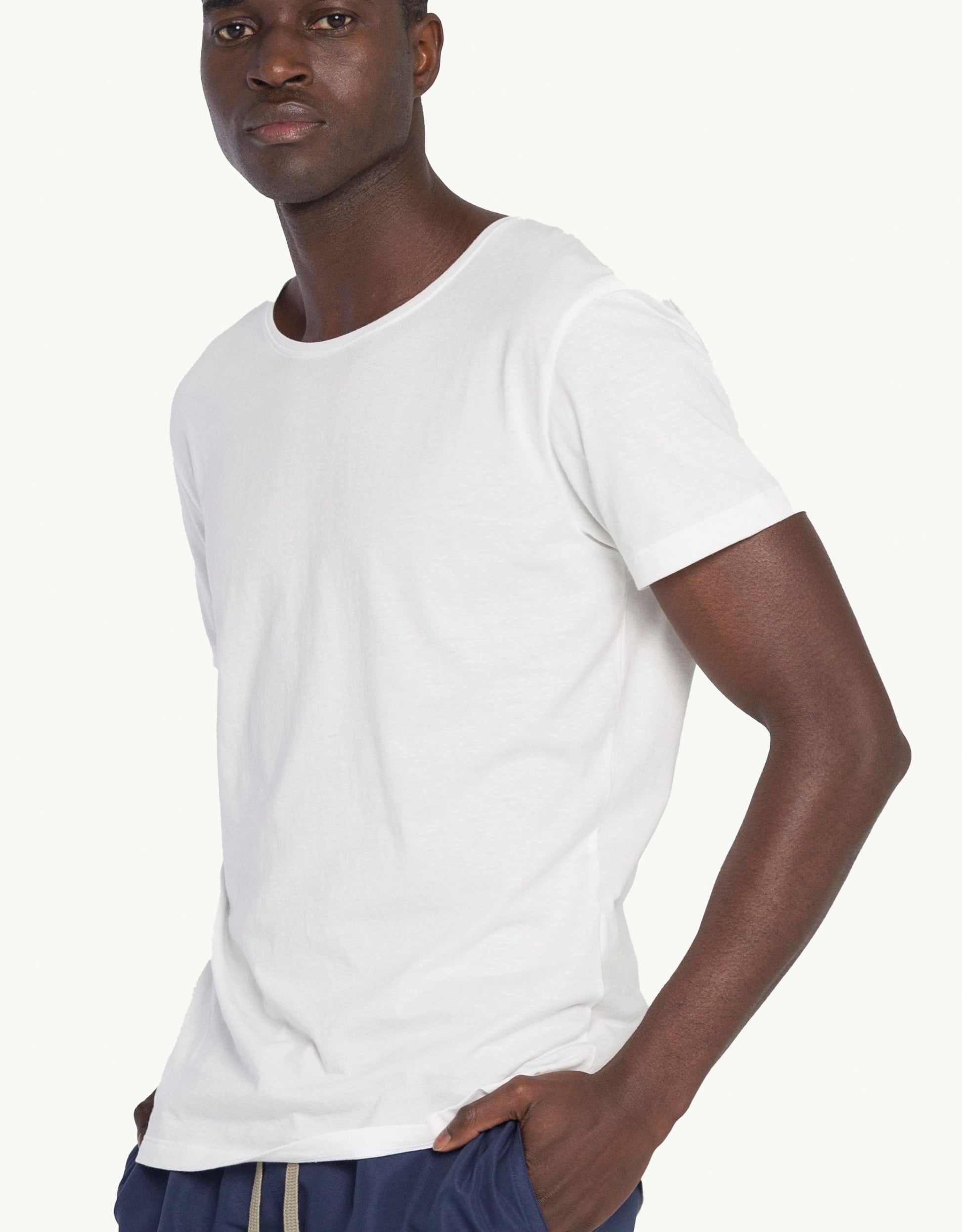 Explore sustainable fashion for men with our essential Unku Blanc T-shirt in white. Crafted for everyday luxury, our tees offer unmatched softness and all-day comfort. Stay cool in our breathable organic cotton tees, made from 100% organic cotton for sustainability and skin-friendly wear